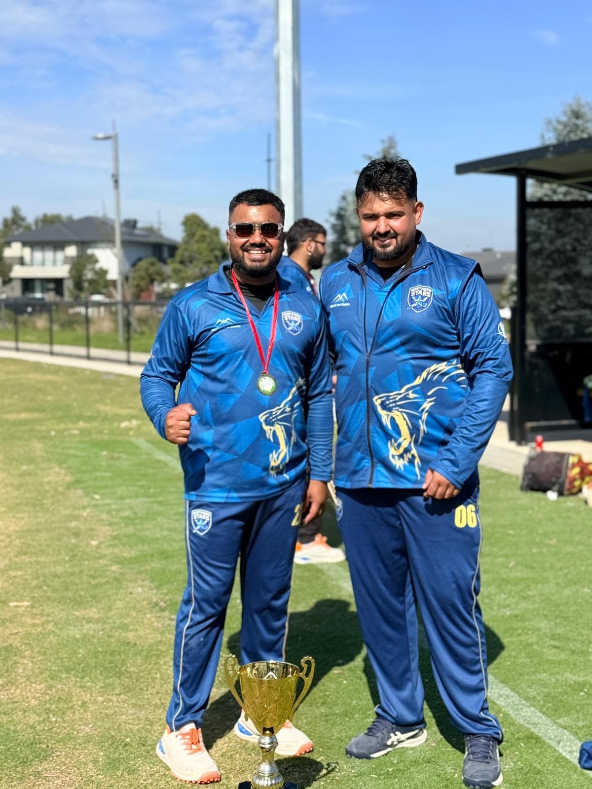 Northern Stars Cricket Club player holding the 2026 championship trophy